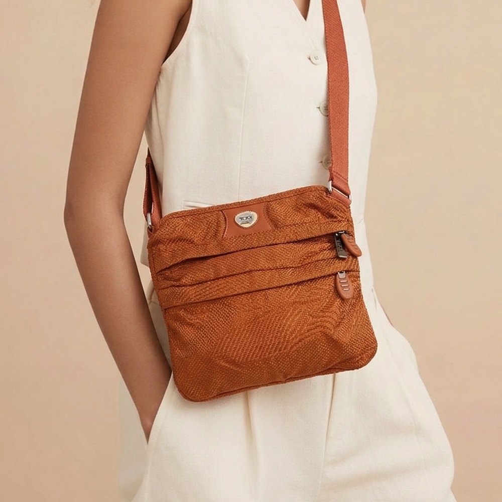 Tumi orange multiple zipper crossbody bag